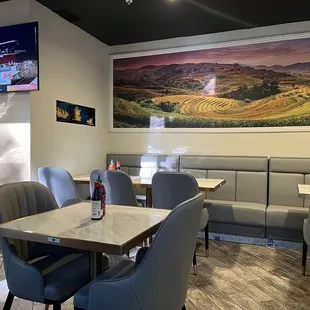 a dining area with tables and chairs