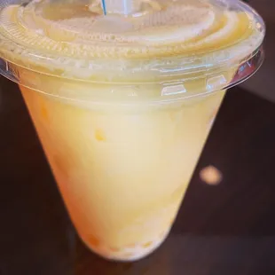 Passion fruit milk tea with bursting boba