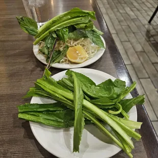 4 leaves on the usual plate with basil, beansprouts, lemon wedge, jalapeño. Look at the extra plate they brought out!!!
