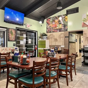 a restaurant with tables and chairs