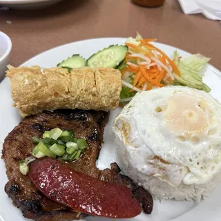 67. Fried Shrimp Cake, Chinese Sausage, Pork Chop, and Egg over Rice
