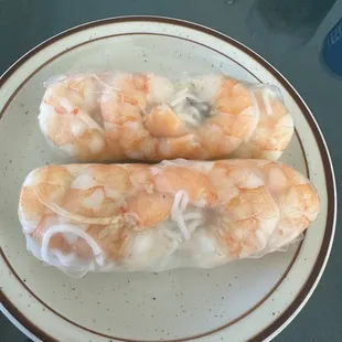 two shrimp rolls on a plate