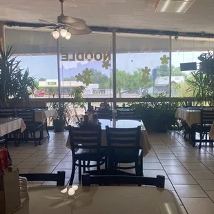 a restaurant with tables and chairs