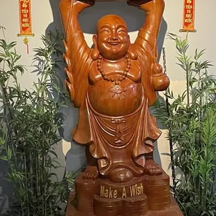 a statue of a laughing buddha
