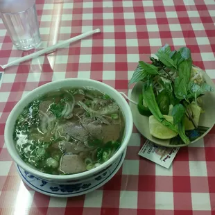 a bowl of soup and a plate of salad