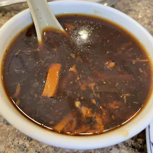 a bowl of soup with a spoon