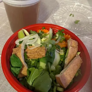 P9. Pho Vegetable Combination with Tofu (to go) Shrimp spring rolls in back