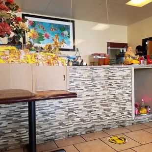 a restaurant with a tiled counter