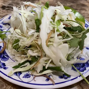 a plate of salad on a table