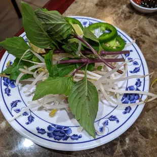 Beans sprout, Thai basil, lime wedges and sliced jalapenos for to put in your Pho soup if you want.