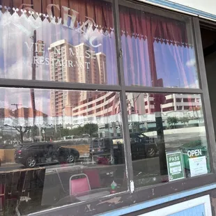 the reflection of a building in the window