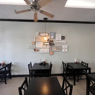 a dining area with tables and chairs