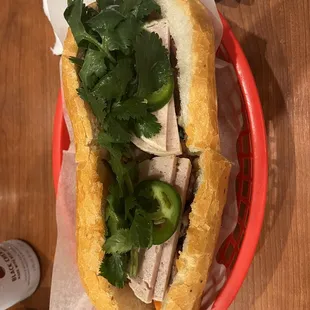 a sandwich in a basket on a table