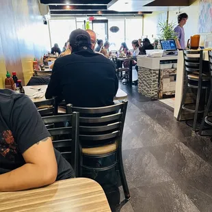 a man sitting at a table in a restaurant