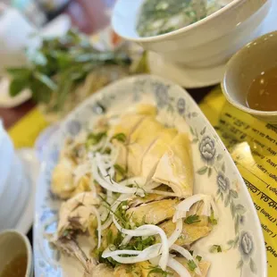 Half chicken pho.  Make sure you dip it in the ginger sauce and then the peppers!!