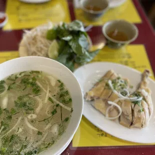 a bowl of soup and a plate of chicken