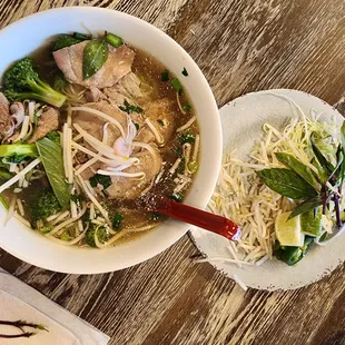 Pho Tai w/ broccoli and fresh spring rolls.