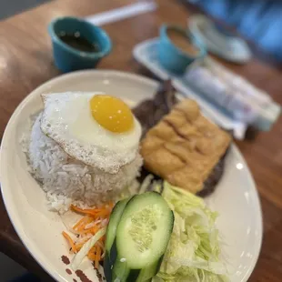 Pork chop , shrimp cake and egg rice plate p