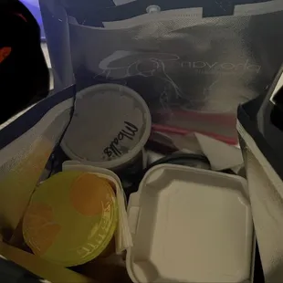 Soup, tea, utensils, cheese wontons in a lined bag!