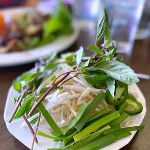 a plate of noodles and vegetables