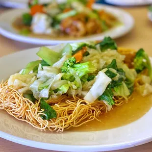 a plate of noodles and vegetables