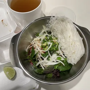 Unpacked takeout #42 pho rice noodle soup with steak, flank and brisket.