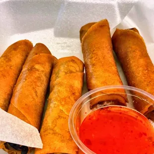 a variety of food items in a styrofoam container