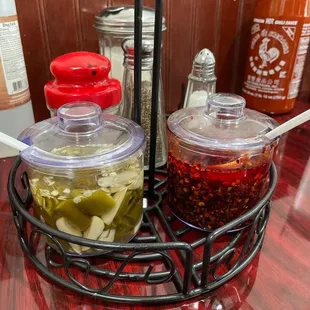 a table with condiments and condiments