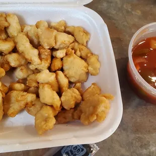 My phone actually made this look more brown than it was it was mostly white with a tan, mushy. Box of factory chicken and red syrup no sour