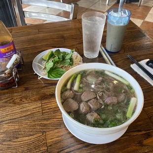 Pho Tai Chin Bo Vien a Vietnamese soup or Pho Dac Biet. Hoisin Sauce, Sriracha ( Tuong Ot) and Sa Te.