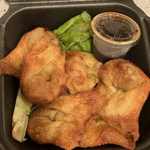 Crispy dumplings...this is to go so they aren&apos;t as crispy by the time they got home so recommend to eat these at the restaurant