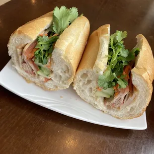 two sub sandwiches on a plate