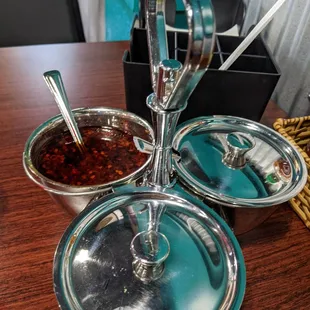 Every table has chili oil, dried chili mix and vinegar. Also on the table is Sriracha, hoisin, salt/pepper and soy sauce