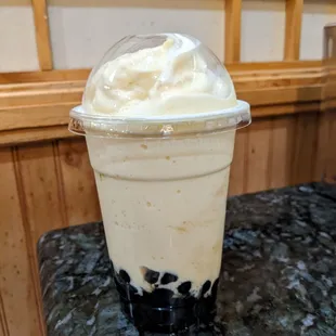 a milkshake in a plastic cup