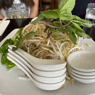 a plate of noodles and chopsticks