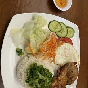 Lemongrass chicken with rice and over easy egg and extra green onions