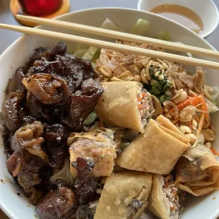 Vermicelli with grilled pork and egg roll.