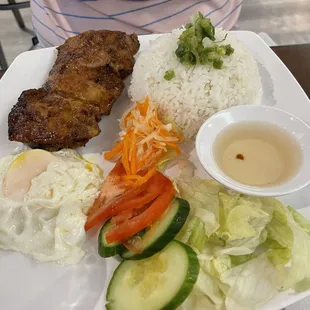 Lemongrass chicken and rice with fried egg