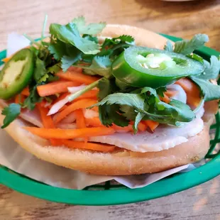A12. Banh Mi with pork meatloaf, pate, homemade butter, carrot, cucumber, jalapeño, cilantro
