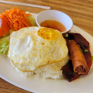 porkchop, eggroll and fried egg rice plate $13.50...$2 can soda...$20 total