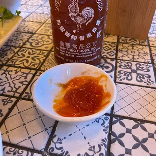 This is the sriracha - it's not actually sriracha but looks like sweet and sour sauce with a lil spice. Definitely not the same thing