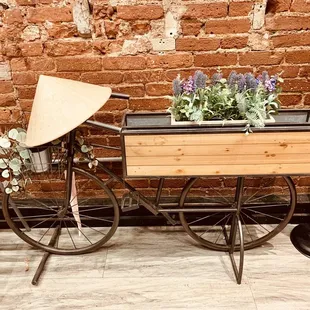 a bicycle with a basket of flowers