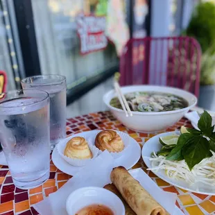 a plate of food and a glass of water