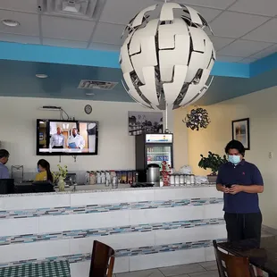 a man standing in a restaurant