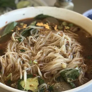 a bowl of soup with noodles and vegetables