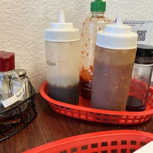Sauces on tables - mostly empty (as were most tables) expect chili paste which was good