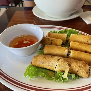 a plate of food with dipping sauce