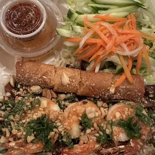 Grilled pork, shrimp and egg roll vermicelli plate. He said it was good!