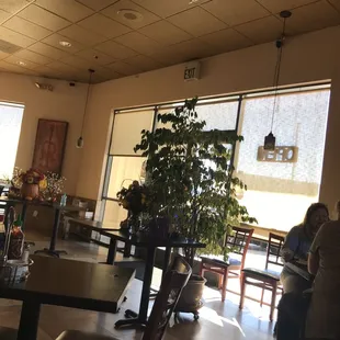 people sitting at tables in a restaurant