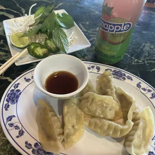 Steamed Gyoza and Snapple drink.